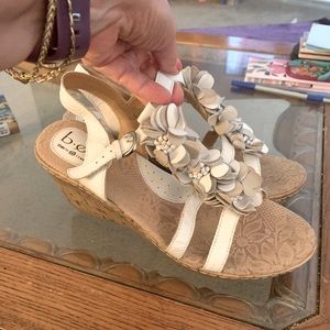 Pair of cute white wedged sandals
